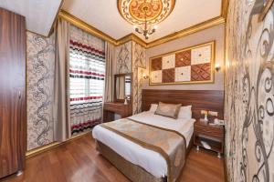 Postel nebo postele na pokoji v ubytování VERSİON HOTEL