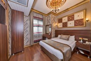 Postel nebo postele na pokoji v ubytování VERSİON HOTEL