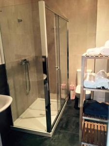 a bathroom with a shower with a glass door at Casa Grande En Centro Historico in Córdoba +80 photos