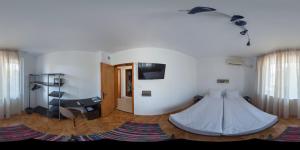 a living room with a bed on the floor at Hotel Mistral in Nesebar