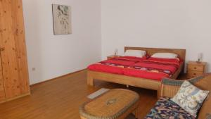 a bedroom with a bed and two chairs at Village Appartements in Waidhofen an der Thaya