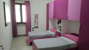 Postel nebo postele na pokoji v ubytování Casa Vacanze Leo