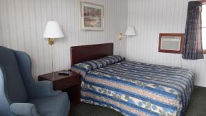 Postel nebo postele na pokoji v ubytování Pine Ridge Motel