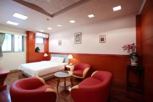 Letto o letti in una camera di Long Shan Hotel