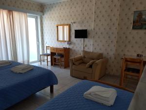 Postel nebo postele na pokoji v ubytování Hotel Apollon