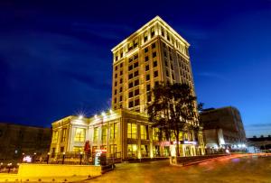 a tall building at night with its lights on at Grand Makel Hotel Topkapi in Istanbul