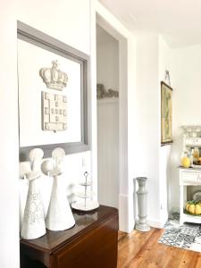 a kitchen with a white counter top and white cabinets at CoimbraAmeias in Coimbra