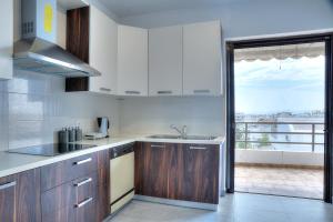 A kitchen or kitchenette at Athens Glyfada Riviera Apartment