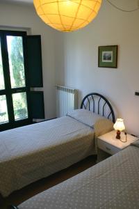 A bed or beds in a room at Casaleaurelia