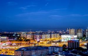 a city lit up at night with buildings and traffic at Grand Makel Hotel Topkapi in Istanbul