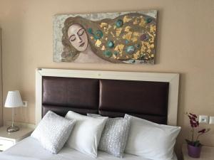 Postel nebo postele na pokoji v ubytování Alexandros Hotel