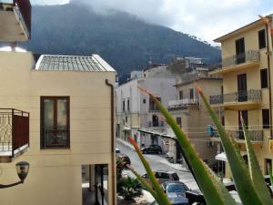 a view of a city with buildings and a mountain at Home Vivaldi in Castellammare del Golfo