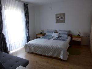 Postel nebo postele na pokoji v ubytování Apartments Toni, Borik