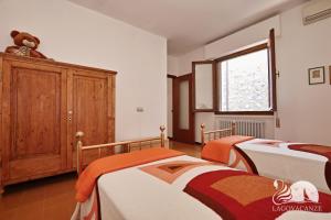 Postel nebo postele na pokoji v ubytování Appartamento le Campanelle + 35 fotografií