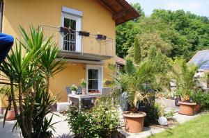 a house with plants in front of it at Passau "Am Sulzsteg" 9 in Passau