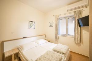 Postel nebo postele na pokoji v ubytování Apartment Cvita