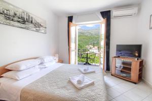 Posteľ alebo postele v izbe v ubytovaní Apartments Nine Slano