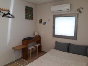 Cama o camas de una habitación en Inside Busan Hostel