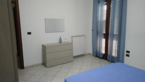 Postel nebo postele na pokoji v ubytování Casa Vacanze Leo