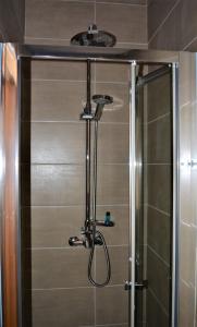 a shower with a glass door in a bathroom at Just Natur Guesthouse in Castro Laboreiro +25 photos