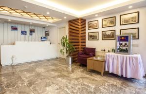 a waiting room with a table and a counter at Buyukada Comfort in Buyukada