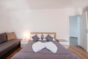 a bedroom with a large bed and a couch at Kevin-Talisa Villa in Bar +73 photos