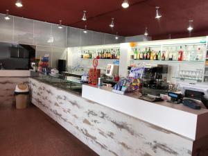 a counter in a coffee shop with a counter at La Staffa B&B Ristorante in Lido Marini