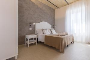 Кровать или кровати в номере Al Faro Bianco B&B