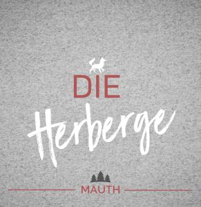 a poster with the words die heritage with a rabbit at Die Herberge in Mauth