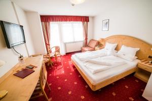 Postel nebo postele na pokoji v ubytování Hotel Pra Tlusel