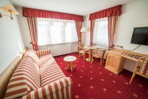 TV a/nebo společenská místnost v ubytování Hotel Pra Tlusel