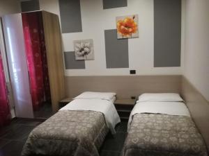 Postel nebo postele na pokoji v ubytování B&B Adriatico