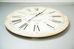 a clock is hanging on a wall at Апартаменти на вул Кониського 5 бічна Личаківської на 6 осіб in Lviv +1 photo