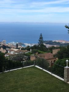 a view of the ocean from the balcony of a house at Monte Carlo View and Spa in La Turbie