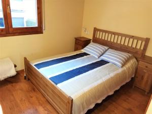 A bed or beds in a room at Apartamento Mirador Del Puigmal