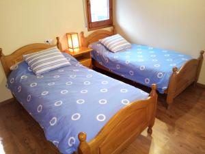 A bed or beds in a room at Apartamento Mirador Del Puigmal