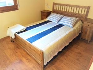 A bed or beds in a room at Apartamento Mirador Del Puigmal