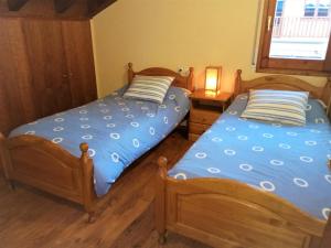 A bed or beds in a room at Apartamento Mirador Del Puigmal