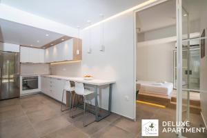 A kitchen or kitchenette at Nikis Dream Comfy Apartments
