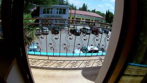 a view of a parking lot from a balcony at Canyon Hotel in Martvili