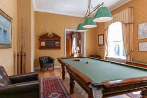 a billiard room with a pool table in it at Storebro Herrgård in Vimmerby