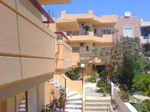 a view of a building from the street at Leonidas Rooms in Platanias