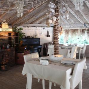a dining room with a white table and chairs at Lethe Exclusive Hotel in Ağva