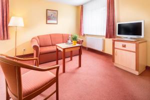 TV a/nebo společenská místnost v ubytování Hotel Atlantis