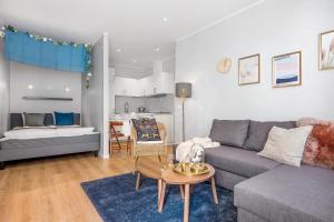 a living room with a couch and a table at NG Apartments in Bergen