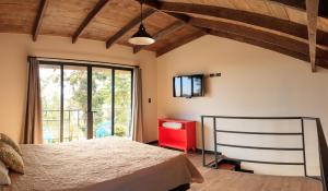 Postel nebo postele na pokoji v ubytování Villa Calas