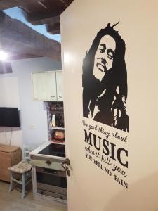 a door in a kitchen with a poster on it at La Casina in Chiusi