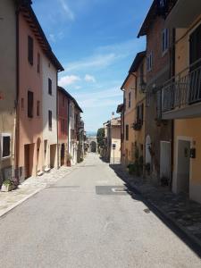 an empty street in a town with buildings at La Casina in Chiusi