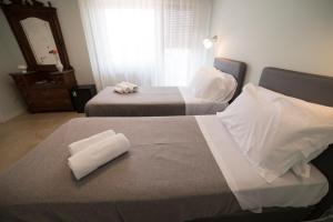 Posteľ alebo postele v izbe v ubytovaní B&B Attico 33