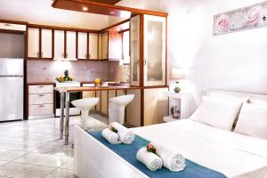 Kuchyň nebo kuchyňský kout v ubytování Del Sol Suites